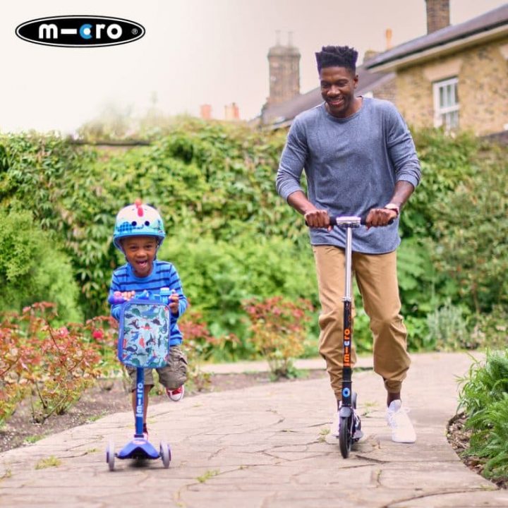 kid and man riding Micro Scooters